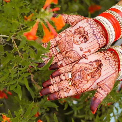 Close-up of a bride's hands with traditional henna